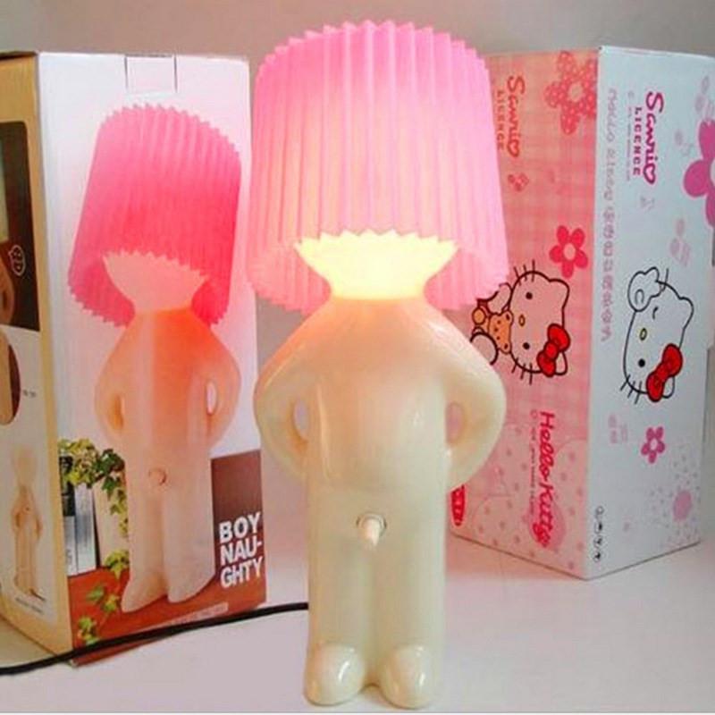 Shy little boy reading lamp